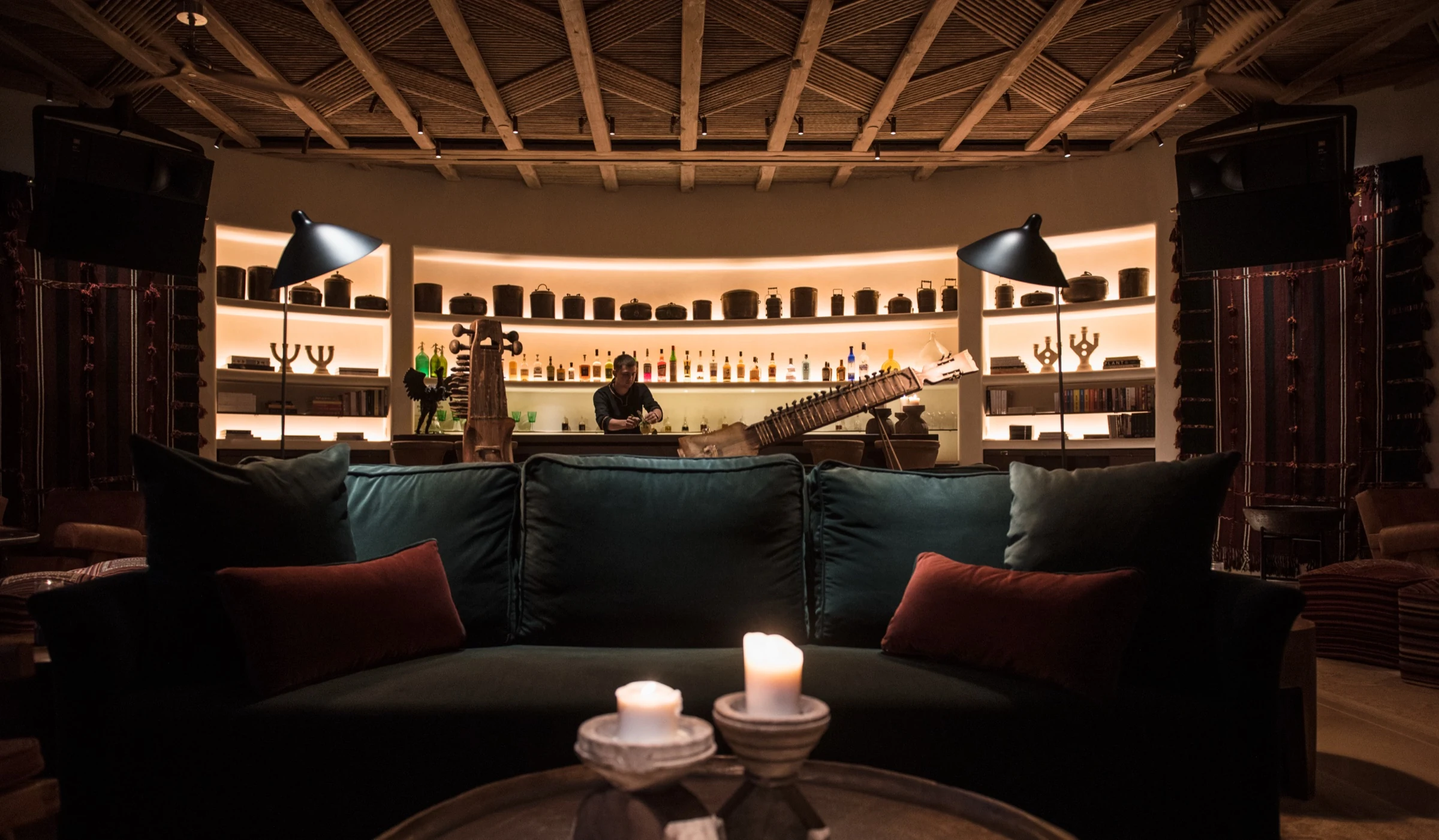 Lounge bar with green velvet sofa at Six Senses Shaharut